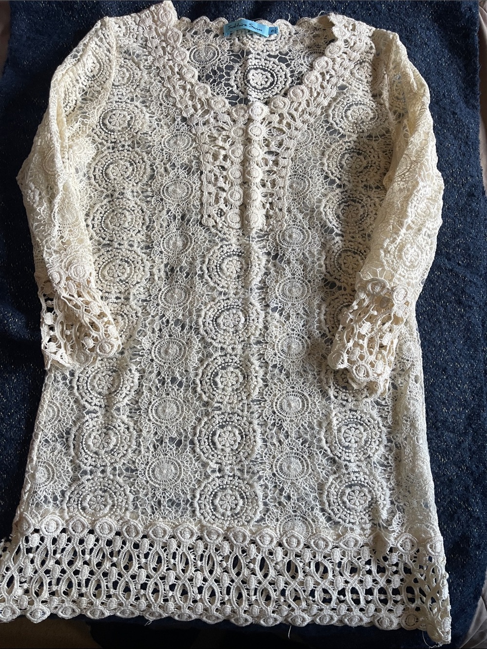Solitaire Swim cream crochet lace overlay with navy lining